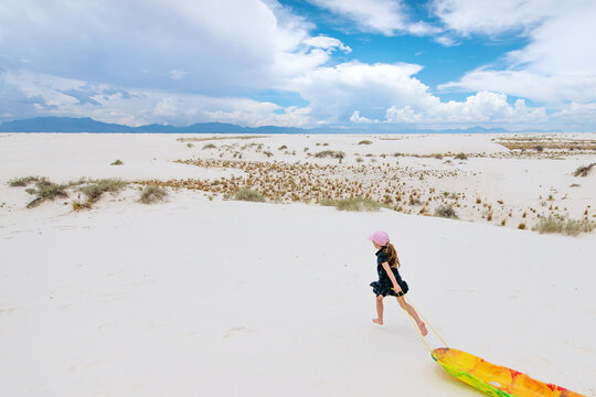 Sledding On White Sand 