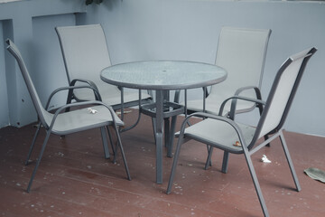 Set of chair and table at outdoor patio near the swimming pool for relax