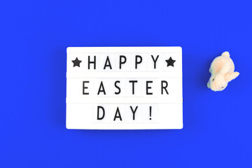 Happy Easter Day text on lightbox, festive background for holidays