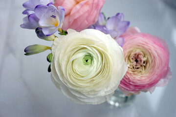Fototapeta na wymiar Beautiful bouquet with spring ranunculus and freesias