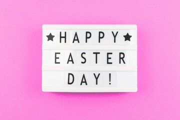 Happy Easter Day text greeting card concept with lightbox on a purple background