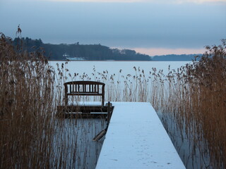 Snow covered Pier at Lake with Reed