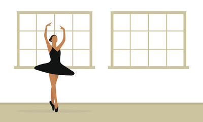 Fototapeta premium Ballerina dancing in a room with windows