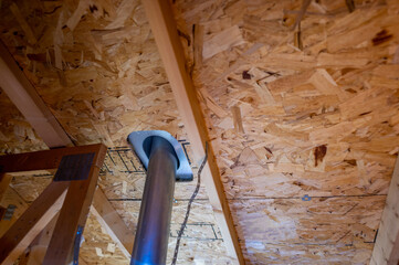 roof vent pipe seen from the attic with flashing for a weather seal
