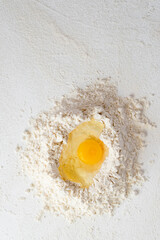 Raw chicken Organic Brown free range eggs Farm pack on white table Flour basket , egg yolk