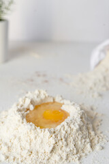 Raw chicken Organic Brown free range eggs Farm pack on white table Flour basket , egg yolk