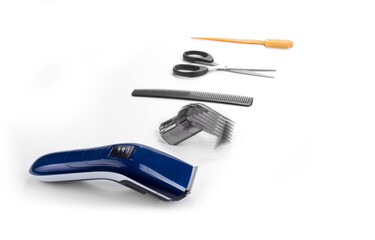 Hair trim machine and accessories on a white background