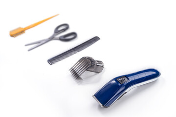 Hair trim machine and accessories on a white background