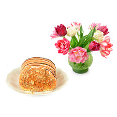 Obraz na płótnie Canvas Cake and vase with flowers isolated on white background.