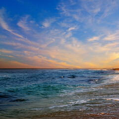 Obraz premium Beach sunrise over the tropical sea