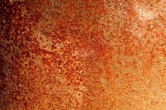 Rusty Red Sheet Of Metal Lit By Sunlight.