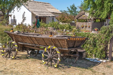Obraz premium Stylized rustic Cossack courtyard with a wooden cart