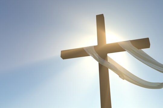 SILUETA DE CRUZ CRISTIANA CON EL MANTO COLGADO Y DESTELLA DEL SOL, CRUXIFICCION DE JESUS 