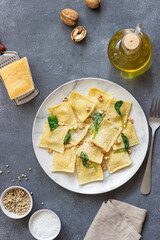 Ravioli with ricotta cheese, spinach and nuts. Healthy eating. Vegetarian food. Italian cuisine.