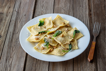 Ravioli with ricotta cheese, spinach and nuts. Healthy eating. Vegetarian food. Italian cuisine.