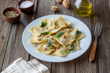 Ravioli with ricotta cheese, spinach and nuts. Healthy eating. Vegetarian food. Italian cuisine.