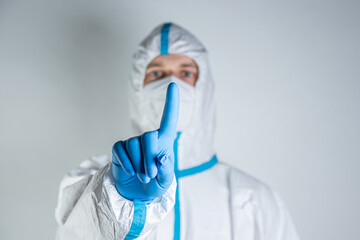 Doctor in protective suit mask isolated on white background studio. Epidemic pandemic rapidly spreading coronavirus 2021 medicine flu virus concept