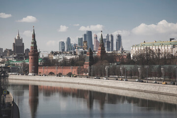 Fototapeta na wymiar Beautiful Moscow Kremlin on the river bank. High towers. Sunny day. Ancient architecture. Center of Moscow.
