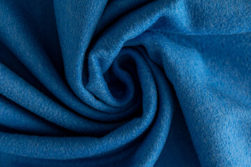 top view blue fleece rolled into a spiral