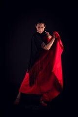 flamenco woman red skirt and shawl bullfighter pose