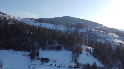 Drone shot. View of the village at the foot of the mountains. Carpathians. Ukraine.