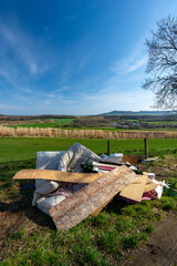 Illegal Fly Tipping of household Rubbish Next to a Farmers Field overlooking the Beautiful Views of...