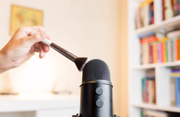 Brush touching the microphone. Making ASMR sounds with the movement of a makeup brush. Concept of...