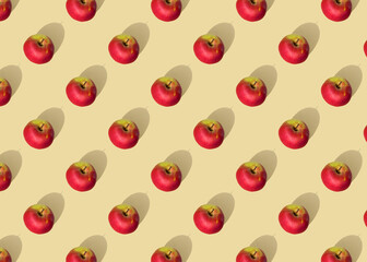 pattern of ripe red apples on a light background