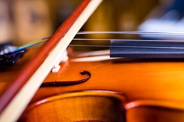 Violinist hands playing violin orchestra musical instrument closeup indoor