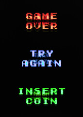 Ending messages for a retro 8-bit videogame: game over, try again, insert coin. Analog TV screen distortion.
