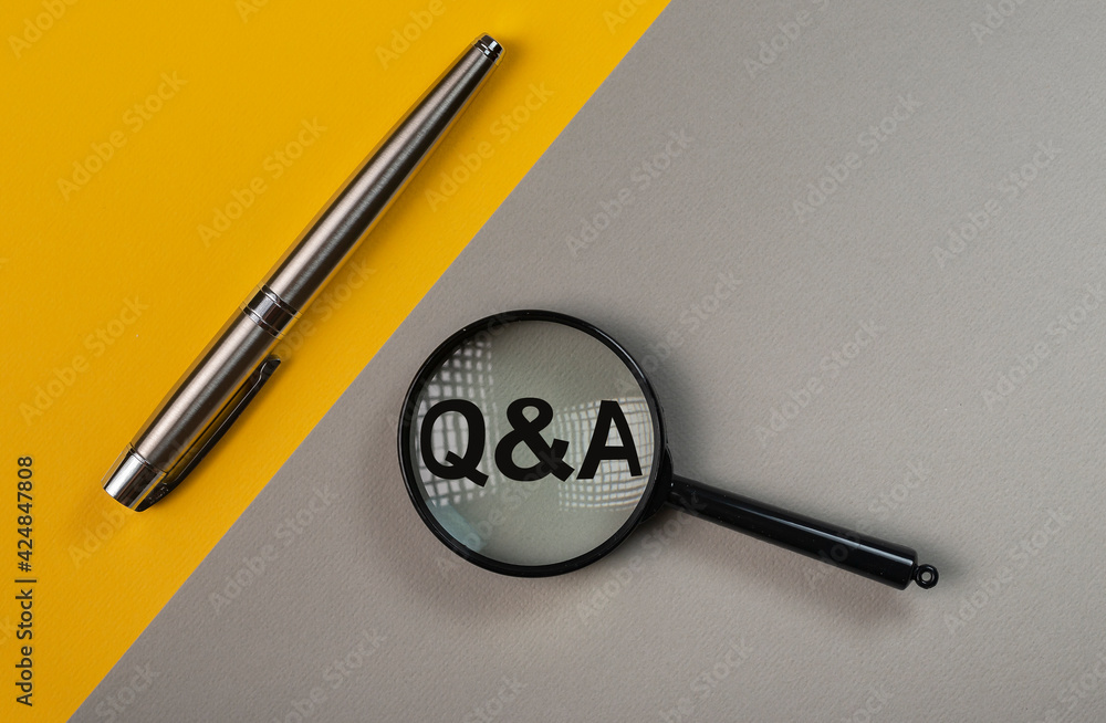 Poster q or qa concept through magnifying glass on yellow and gray colored background