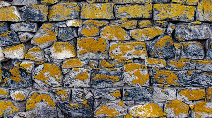 Old stone wall with moss