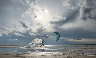 A fabulous girl in a long transparent dress fluttering in the wind and a high headdress on the...