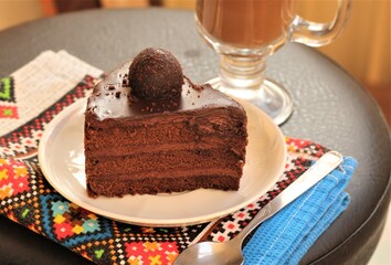 piece of delicious cake with chocolate and coffee