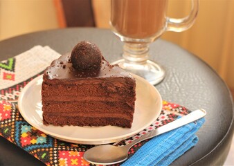 chocolate cake with coffee on a plate