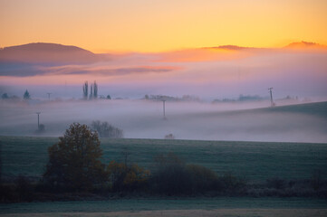 Fairy tale scenery, sunrise foggy autumn morning