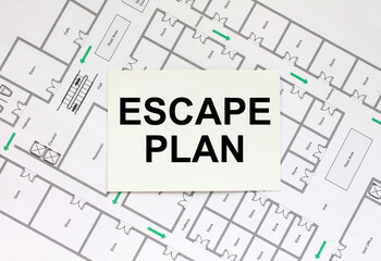 Business card with text Escape Plan on a construction drawing