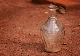 old glass bottle on the ground

