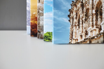 Canvas prints stacked on white surface. Photo printed on canvas