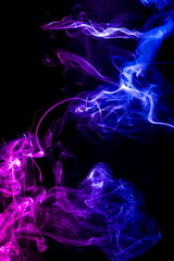 Colored smoke on black background