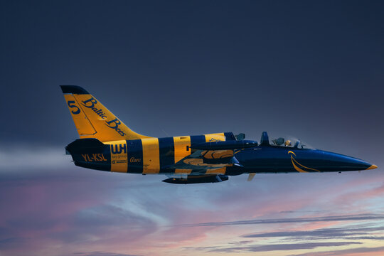 Baltic Bees jet team during display show. Close flight of aerobatic team