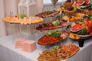 Slicing different types of cheese and meat