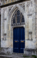 Fototapeta na wymiar The blue wood doors of a British church somewhere in England, UK