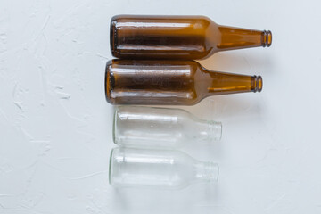 STELKED bottles on a light background, garbage sorting rules, dark bottle, light