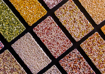 Samples of multi-colored drywall construction material for the decoration of the facade and interior of buildings, close up