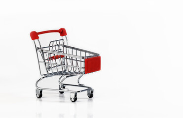 An empty supermarket cart with red inserts on a white background.