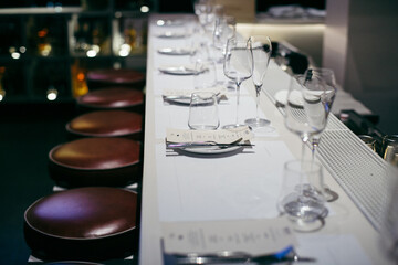 Restaurant table set for a fancy dinner with a peace of Kobe beef as a demonstration