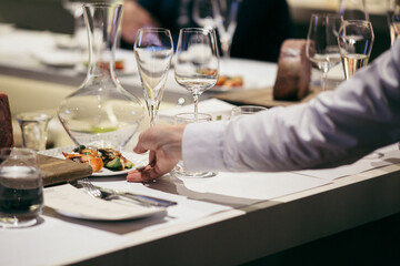 Restaurant table set for a fancy dinner with a peace of Kobe beef as a demonstration
