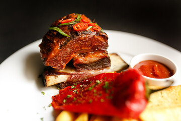 freshly cooked beef rib served with sweet pepper and grilled organic vegetables as the main course in a fancy restaurant during lunctime