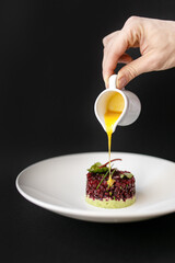 Vegetarian beetroot and vegetable tartare served with bearnaise sauce in a restaurant for lunch